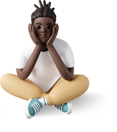 A man sitting cross-legged on the floor with his head in his hands